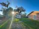 Spacious backyard features a storage shed and mature trees offering ample outdoor living space at 2341 Weber St, Lakeland, FL 33801