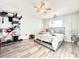 Cozy bedroom features wood floors and a ceiling fan at 2341 Weber St, Lakeland, FL 33801