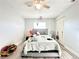 Bright bedroom with wood floors, a ceiling fan, and plenty of natural light at 2341 Weber St, Lakeland, FL 33801