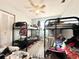 Bedroom featuring bunk beds, a ceiling fan, and ample space for children or guests at 2341 Weber St, Lakeland, FL 33801