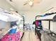 A bright bedroom with bunk beds and a ceiling fan, providing comfortable sleeping arrangements at 2341 Weber St, Lakeland, FL 33801