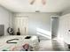 Sunlit bedroom with hardwood floors, a closet, and modern ceiling fan offering a calm space at 2341 Weber St, Lakeland, FL 33801