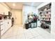 This kitchen offers white cabinets and tile flooring, with space for storage and food preparation at 2341 Weber St, Lakeland, FL 33801