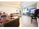 A comfortable living room with tile floors, natural light, and fan that is ideal for relaxation at 2341 Weber St, Lakeland, FL 33801