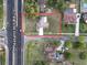 This aerial shows the boundary of the home near Pleasant Hill Rd, and Suzette Dr outlined in red for reference at 1968 Pleasant Hill Rd, Kissimmee, FL 34746
