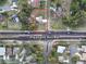 An aerial view of the home showcasing its proximity to Pleasant Hill Rd, and the property boundary outlined in red at 1968 Pleasant Hill Rd, Kissimmee, FL 34746