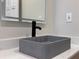 Modern bathroom with a concrete sink, contemporary fixtures, and a lit mirror for a spa-like feel at 1968 Pleasant Hill Rd, Kissimmee, FL 34746