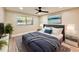 Well-lit bedroom with a large bed, side tables, and a large window offering natural light and pleasant views at 1968 Pleasant Hill Rd, Kissimmee, FL 34746