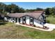Stunning single-story home featuring a unique architectural design and a well-manicured front yard at 1968 Pleasant Hill Rd, Kissimmee, FL 34746