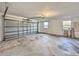 Spacious garage with windows and an automatic garage door at 1968 Pleasant Hill Rd, Kissimmee, FL 34746
