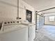 Garage with a washer, dryer and a blue entry door into the house at 1968 Pleasant Hill Rd, Kissimmee, FL 34746