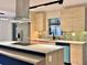 Contemporary kitchen featuring stainless steel appliances, sleek cabinetry, and an eat-in island at 1968 Pleasant Hill Rd, Kissimmee, FL 34746