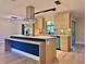 Modern kitchen with stainless steel appliances, updated cabinets, and a spacious island at 1968 Pleasant Hill Rd, Kissimmee, FL 34746
