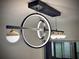 Stylish, modern pendant lighting fixture with unique circular designs and decorative globes hanging from the ceiling at 1968 Pleasant Hill Rd, Kissimmee, FL 34746