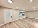 Spacious living room featuring modern flooring, fresh paint, and ample natural light at 1968 Pleasant Hill Rd, Kissimmee, FL 34746