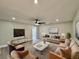 Bright living room featuring modern furnishings and décor, perfect for relaxation and entertainment at 1968 Pleasant Hill Rd, Kissimmee, FL 34746