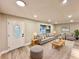Bright living room with a modern design, neutral colors, and ample seating at 1968 Pleasant Hill Rd, Kissimmee, FL 34746