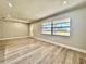 Expansive living room with modern flooring, neutral walls, and ample natural light at 1968 Pleasant Hill Rd, Kissimmee, FL 34746