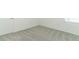 Neutral bedroom featuring gray carpet and baseboards at 2084 Babbling Brook Blvd, Auburndale, FL 33823