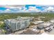 Stunning aerial view of condominium complex featuring beautiful architecture and lush landscaping with city views at 2305 Edgewater Dr # 1606, Orlando, FL 32804