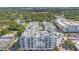 Top-down aerial shot showcases the building's unique rooftop pool and lounge area for residents at 2305 Edgewater Dr # 1606, Orlando, FL 32804