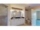 Elegant bathroom features a double-sink vanity, granite countertops, walk-in shower, and a separate toilet area at 2305 Edgewater Dr # 1606, Orlando, FL 32804