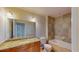 Bathroom with granite countertops, tile backsplash, and soaking tub at 2305 Edgewater Dr # 1606, Orlando, FL 32804