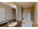 Bathroom boasts granite countertops and a tiled tub and shower at 2305 Edgewater Dr # 1606, Orlando, FL 32804