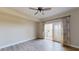 Open bedroom with wood flooring, ceiling fan, leading to balcony through sliding glass doors at 2305 Edgewater Dr # 1606, Orlando, FL 32804