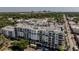 Aerial view of a condo complex with lush green trees and an urban skyline at 2305 Edgewater Dr # 1606, Orlando, FL 32804