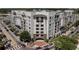Modern apartment building featuring a brick entrance, balconies, and stylish architectural details at 2305 Edgewater Dr # 1606, Orlando, FL 32804