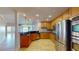 Stylish kitchen with wooden cabinets, stainless appliances, granite countertop, and an open layout at 2305 Edgewater Dr # 1606, Orlando, FL 32804