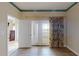 Sun-lit living area featuring elegant hardwood floors, neutral paint and doors to terrace at 2305 Edgewater Dr # 1606, Orlando, FL 32804