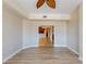 Bright living room featuring hardwood floors and an open floor plan leading to the kitchen at 2305 Edgewater Dr # 1606, Orlando, FL 32804