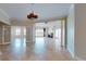Open living space with tile floors, decorative columns, fireplace and large windows at 2305 Edgewater Dr # 1606, Orlando, FL 32804