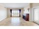 Cozy living room features a fireplace, large windows, and ample space at 2305 Edgewater Dr # 1606, Orlando, FL 32804