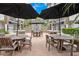 Community outdoor patio area with tables, seating, and stone accents at 2305 Edgewater Dr # 1606, Orlando, FL 32804