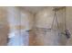 Walk-in shower featuring accessible grab bars, neutral tiling and a mosaic-tiled floor at 2305 Edgewater Dr # 1606, Orlando, FL 32804