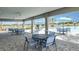 Poolside patio features comfortable seating, tables, umbrellas, and barbecue grills, creating a perfect outdoor space at 2559 Driftwood St, Auburndale, FL 33823