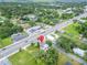 Aerial view of property's location near a four lane road, local businesses, and neighborhood at 800 N Church Ave, Mulberry, FL 33860