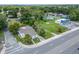 Aerial view showcases property and its proximity to commercial area and street at 800 N Church Ave, Mulberry, FL 33860