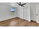 Bedroom with wood floors, white closets, and view from the window at 800 N Church Ave, Mulberry, FL 33860