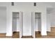 White double door closets with open doors and wood floors at 800 N Church Ave, Mulberry, FL 33860