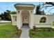 Inviting front entrance with stone archway, modern lighting, and well-maintained landscaping enhances curb appeal at 800 N Church Ave, Mulberry, FL 33860