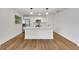 Spacious, open-concept kitchen with a center island, stainless steel appliances, and modern finishes at 800 N Church Ave, Mulberry, FL 33860