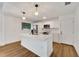 Bright and spacious kitchen featuring a large island, stainless steel appliances, and modern finishes at 800 N Church Ave, Mulberry, FL 33860