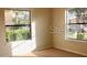 Light-filled bedroom with two windows at 1758 Coriander Dr # 1758, Poinciana, FL 34759