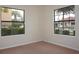 Bright bedroom featuring two windows at 1758 Coriander Dr # 1758, Poinciana, FL 34759