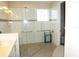 Modern bathroom featuring a glass shower, grab bars, and tile backsplash at 8890 Sw 104Th Cir, Ocala, FL 34481