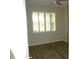 Bright bedroom with wood flooring and large shuttered window at 8890 Sw 104Th Cir, Ocala, FL 34481
